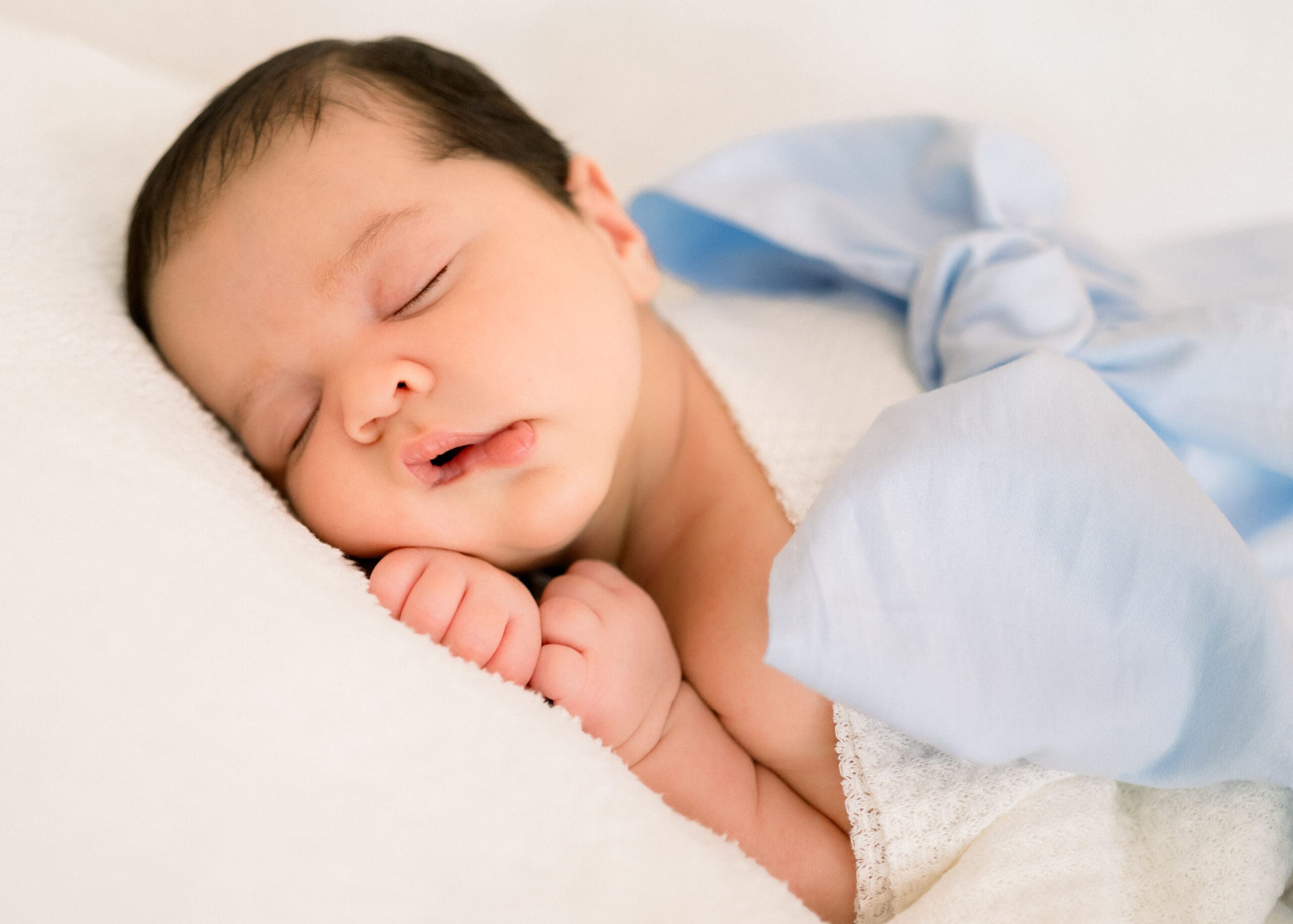 Baby boy sleeping peacefully during his photography session