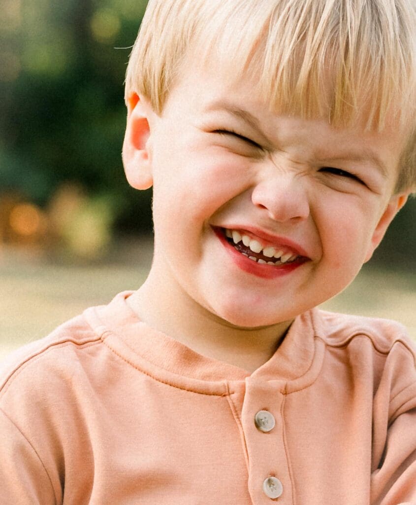 Happy child in soft fall hues during fall petite sessions. Serving Bainbridge and Tallahassee.