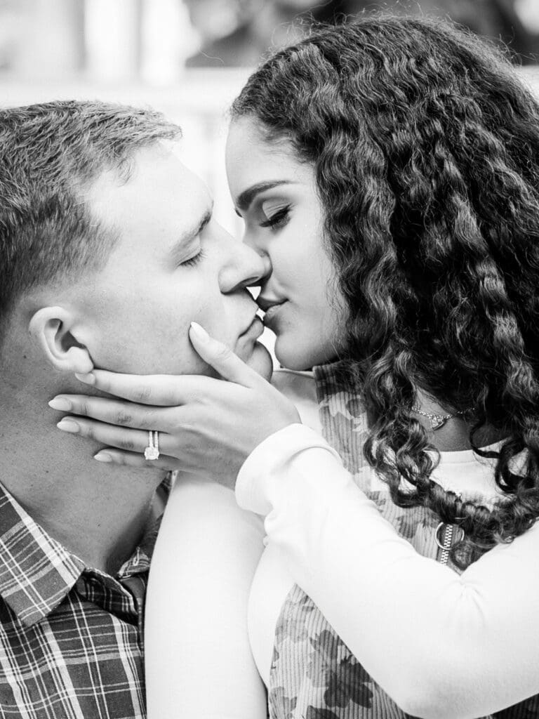 Black and white close-up of couple kissing during anniversary session