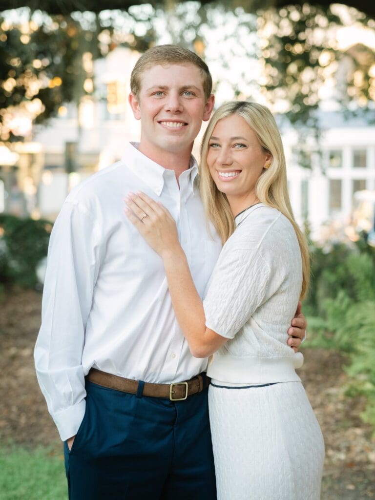 Couple smiling together after engagement proposal