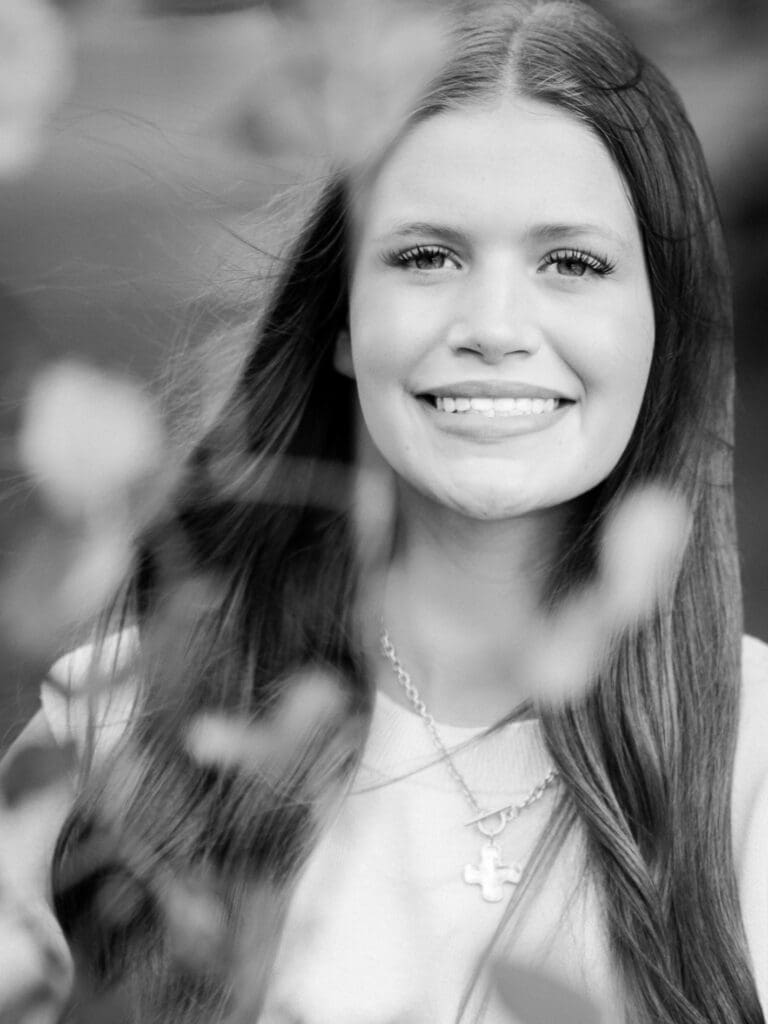 High school senior up close pose captured in black and white. 